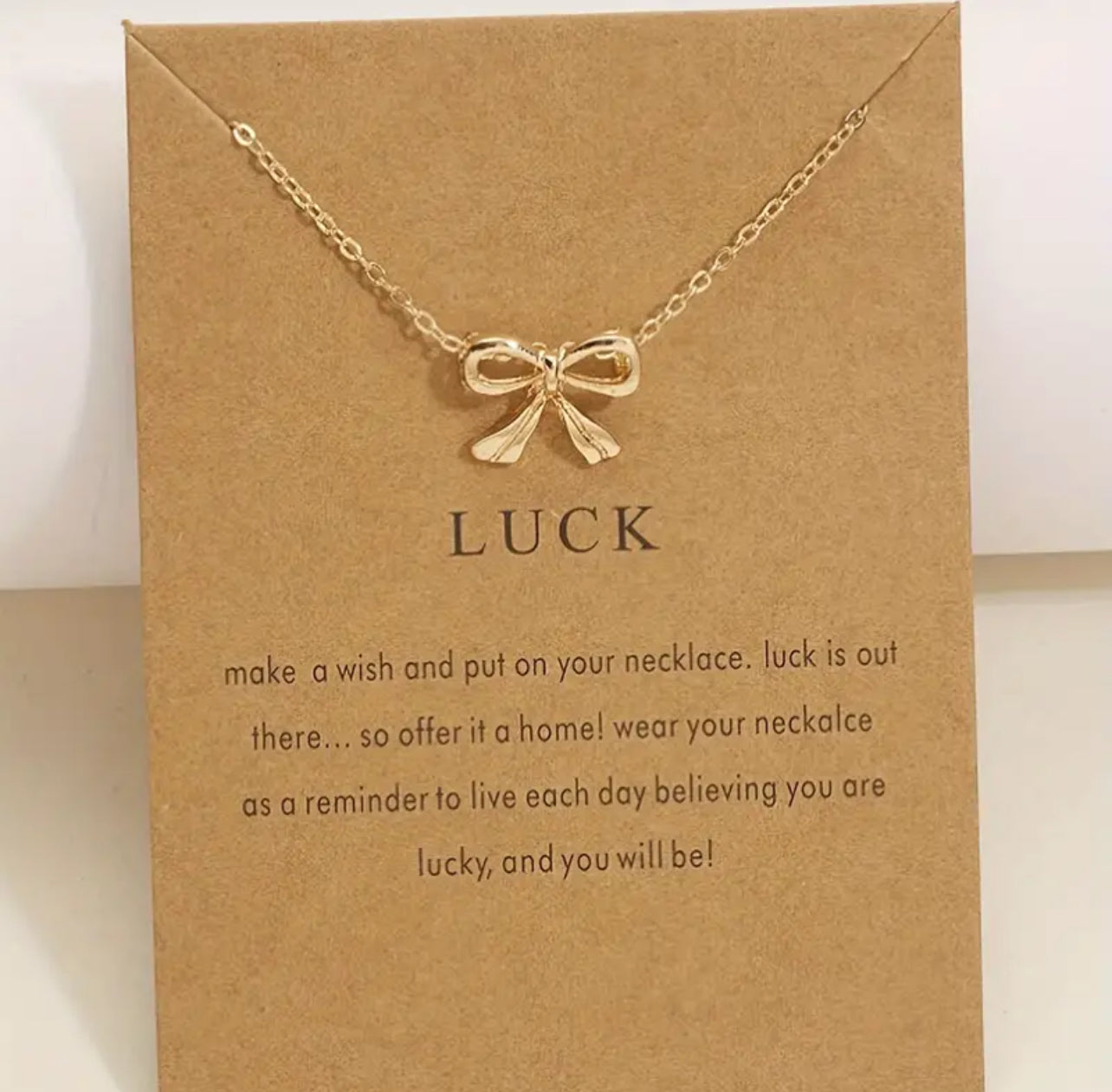 Gold bow necklace