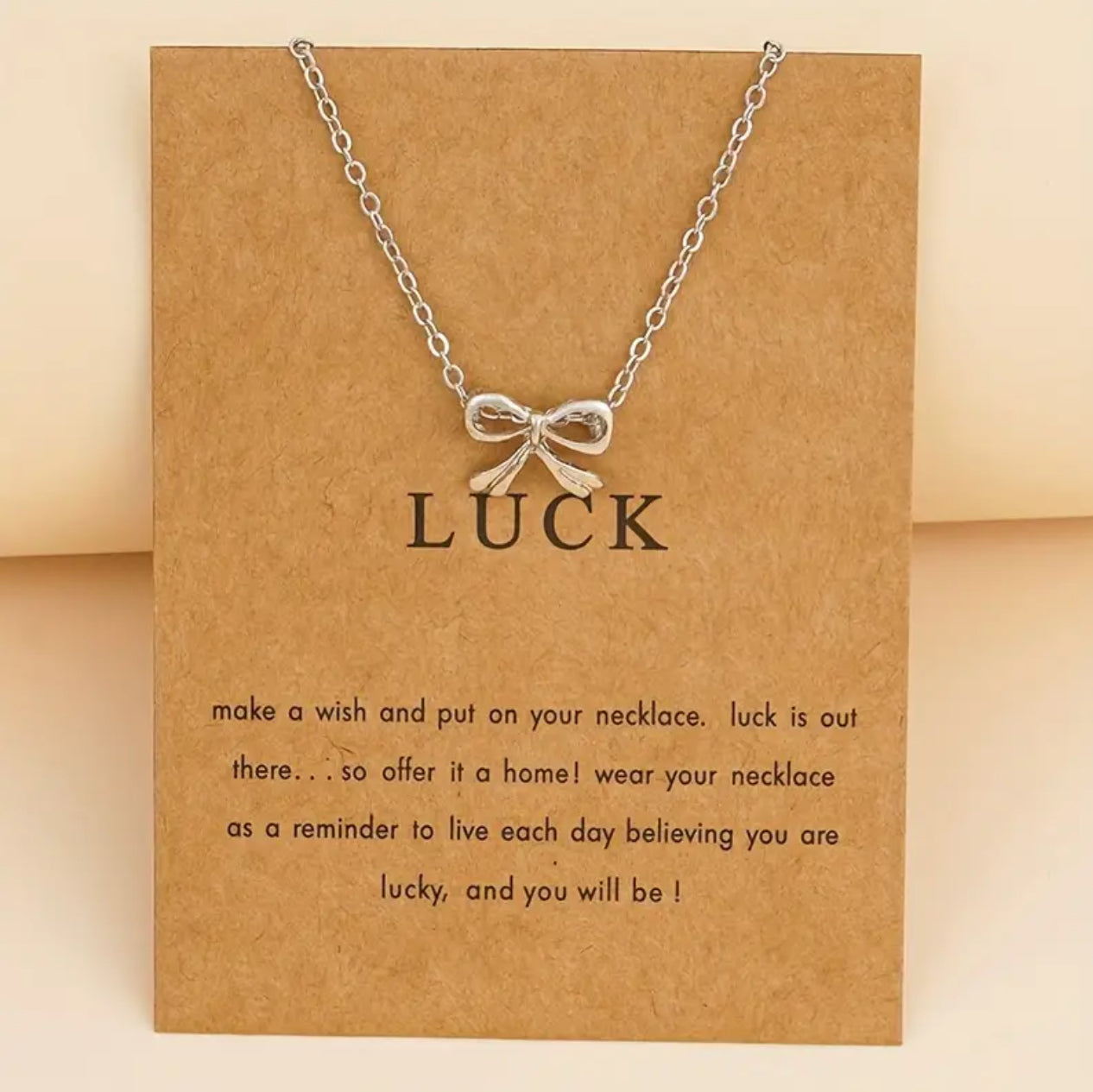 Silver bow necklace